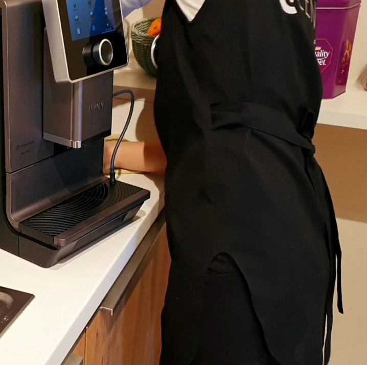 person cleaning the coffee machine