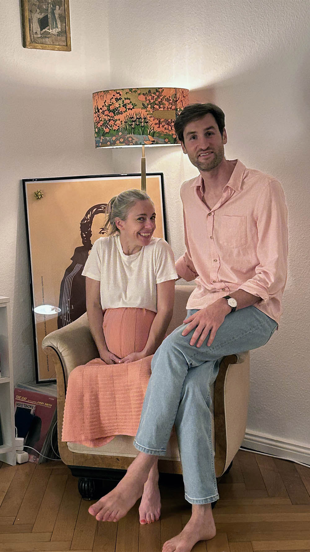 Pregnant woman siting next to a man, both smiling